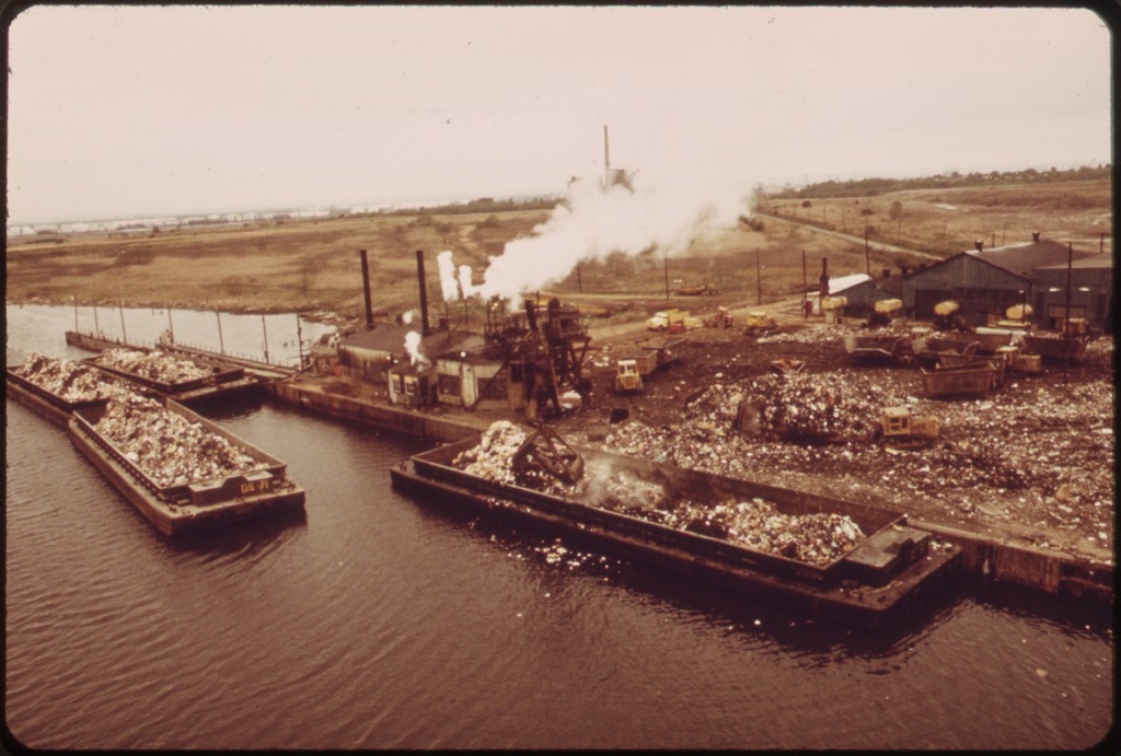 lossy-page1-1024px-GARBAGE_SCOWS_BRING_SOLID_WASTE,_FOR_USE_AS_LANDFILL,_TO_FRESH_KILLS_ON_STATEN_ISLAND,_JUST_EAST_OF_CARTERET,_NJ_-_NARA_-_548315.tif
