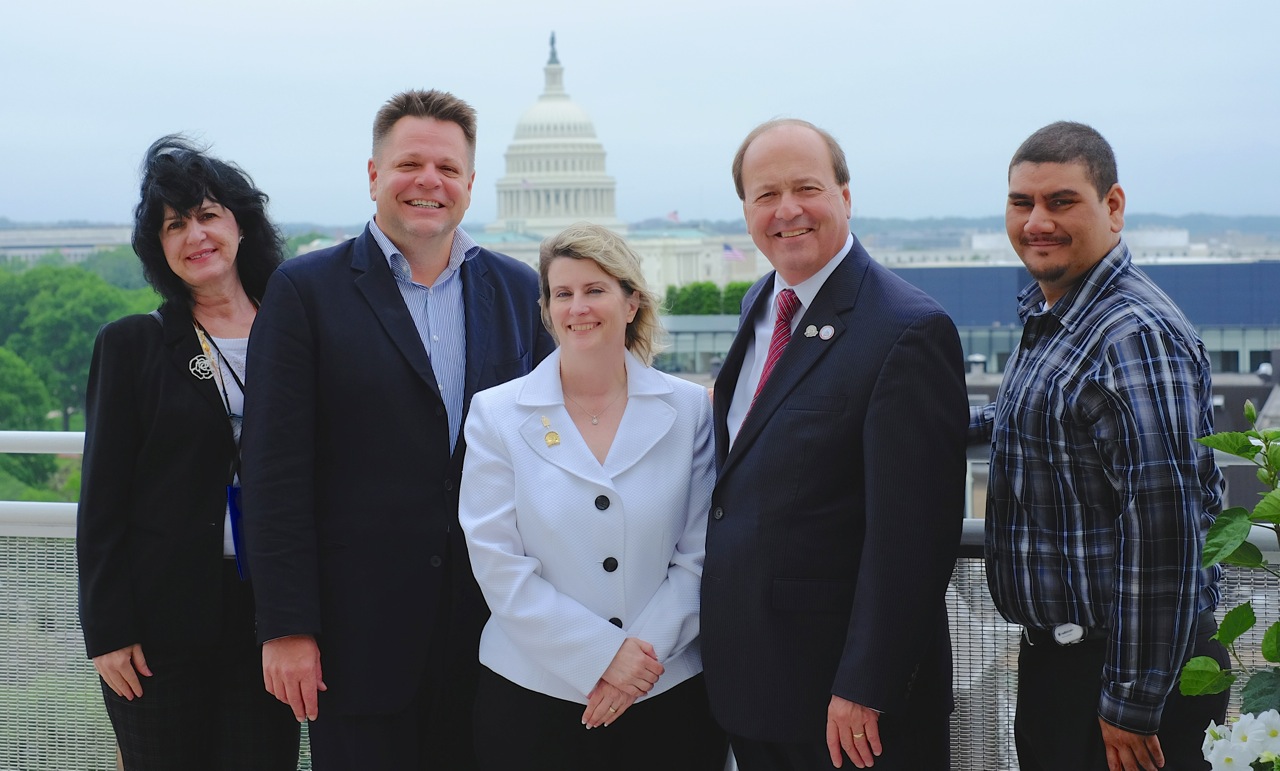 SIBOR members Diane Malagreca;  Laird K;ein, president of the Staten Island Board of Realtos;, Dawn Carpenter;  John Vernazza, and Richard Dunn gather on the roof deck of the National Association of REALTORS Building in Washington, D.C.