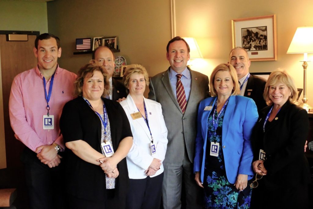 Assemblyman Michael Cusick (D-Mid-Island, Staten Island), center, meets in Albany with representatives of the Staten Island Board of Realtors, from left, Justin Ray; Phyllis Cangro; John Vernazza, SIBOR past president and National Association of REALTORS liaison to Congressman Donovan; Dawn Carpenter, a SIBOR past president serving in the capacity of NYSAR president-elect; Claire Bisignano Chesnoff, president of SIBOR; Greg Sokol, SIBOR president-elect, and Sari Kingsley, SIBOR past president and vice chair of the organization’s Legislative Committee.