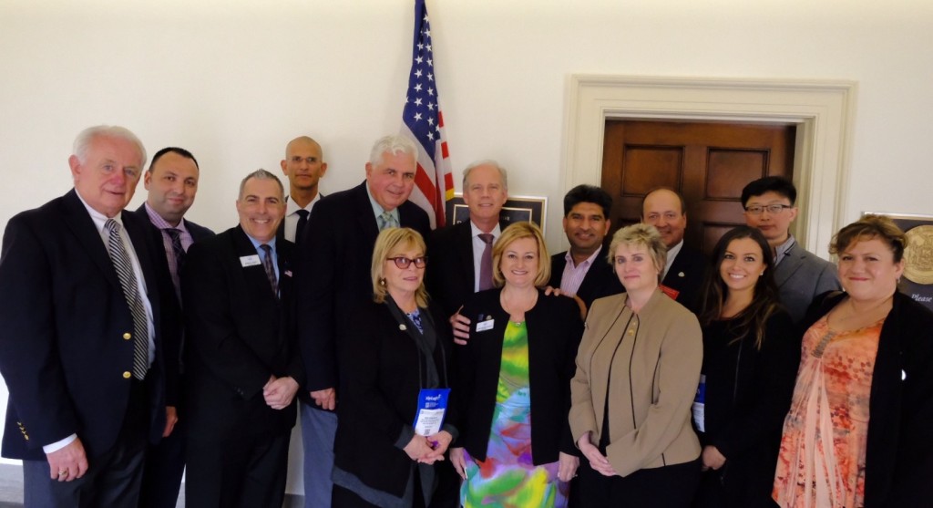 Rep. Daniel Donovan (R-Staten Island/Brooklyn), center, beside flag, meets on Capitol Hill with SIBOR representatives, from left, Sandy Krueger, CEO; Aleksandr Stolyar; Greg Sokol, president-elect; Assaf Epstein, an international director of the National Association of REALTORS®, George K. Wonica, a past president of both SIBOR and the New York State Association of Realtors (NYSAR); Sari Kingsley, SIBOR past president and NAR President’s Liaison to Israel; Claire Bisignano Chesnoff, president of SIBOR; Dil Gillani, immediate past president; Dawn M. Carpenter, SIBOR past president and NYSAR president-elect; John Vernazza, SIBOR past president and NAR liaison to Congressman Donovan; Erica Orlando; Kawing Chiu, and Phyllis Cangro.